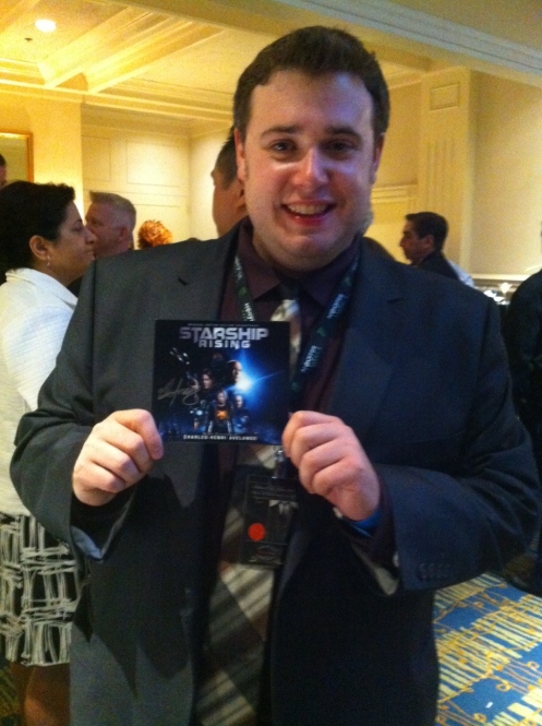 Actor Marc Hawes holds his copy of the award-winning soundtrack